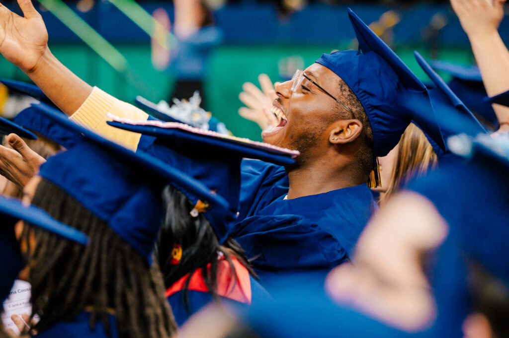 Students celebrate at the December 2023 commencement ceremony.